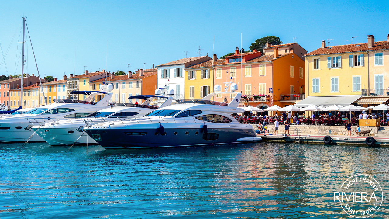 Busy marina harbor during peak yacht charter season